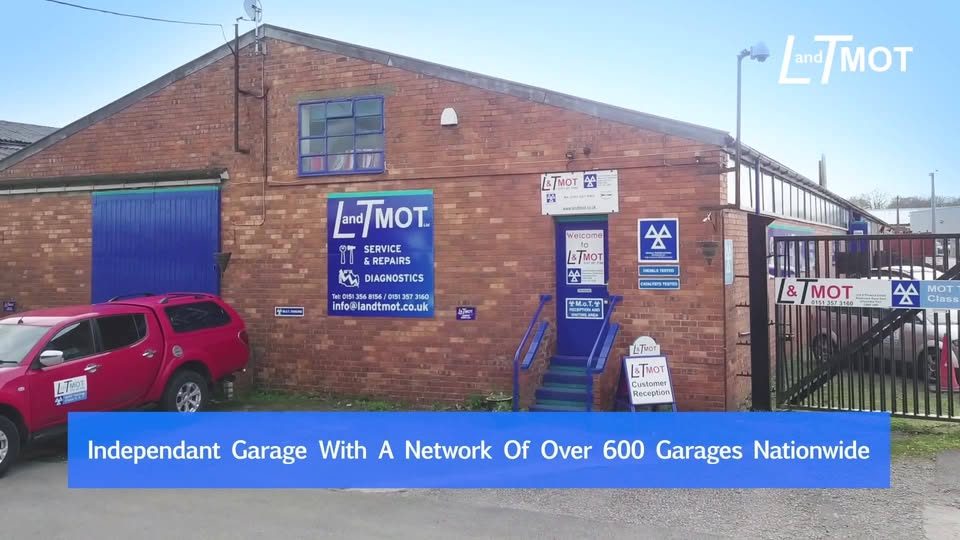 L&T MOT workshop forecourt in Ellesmere Port with customer vehicles parked outside